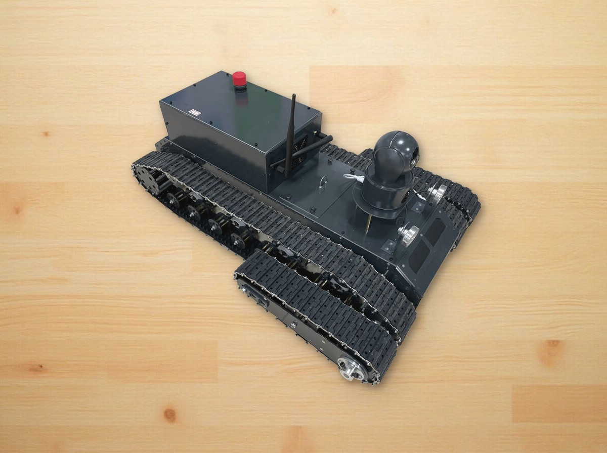 Swing-arm tracked robot with a dark sheet-metal body, PTZ camera, antenna and red stop button