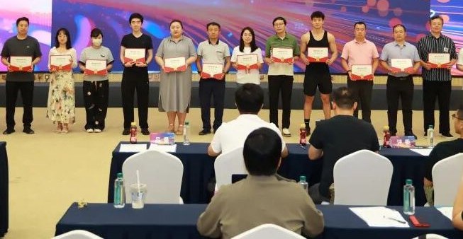 Founder academy graduates on stage holding their certificates