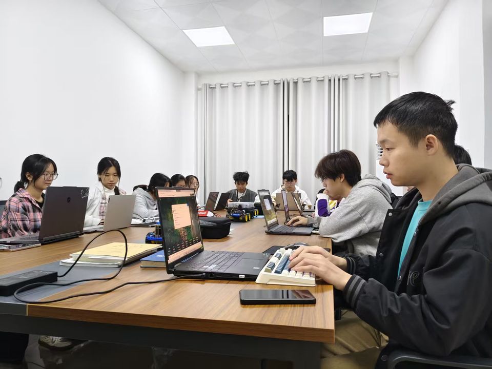 University students at laptops during a PCB design training session