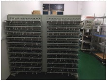 Racks of units in a burn-in room