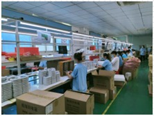 Final assembly line with workers and cartons