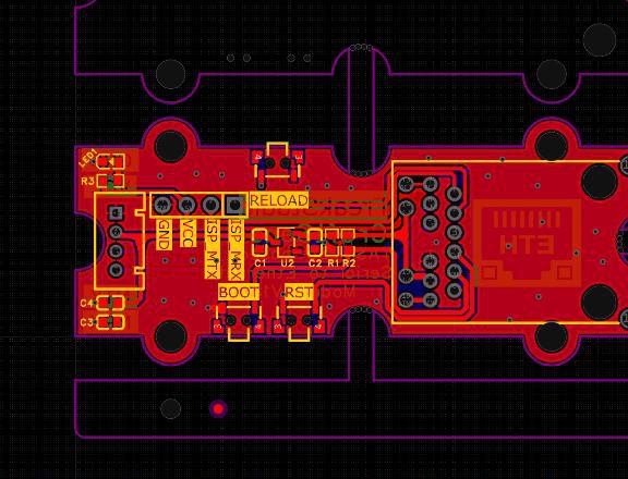 PCB layout screenshot of a small module board with RELOAD, BOOT and RST buttons and an Ethernet jack footprint