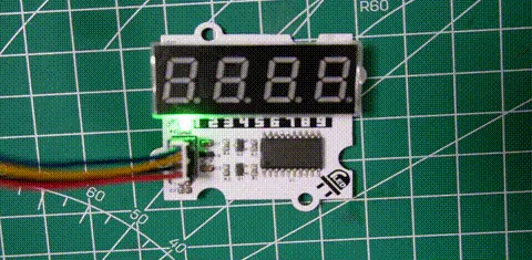 Four-digit red LED display module cycling through blank, 8.888 with a decimal point, 9876, and blank again